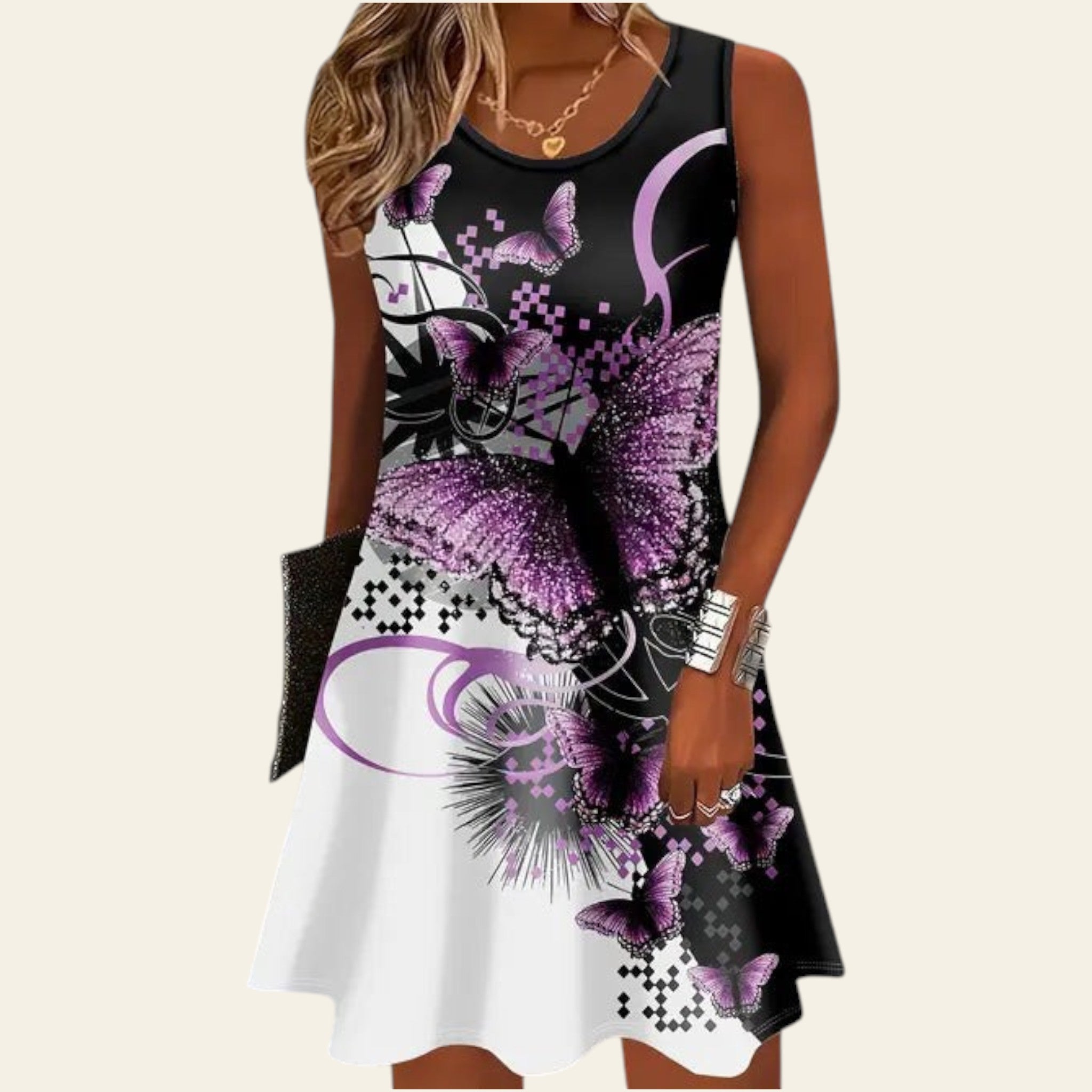 woman wearing a sleeveless black and white dress with purple floral pattern