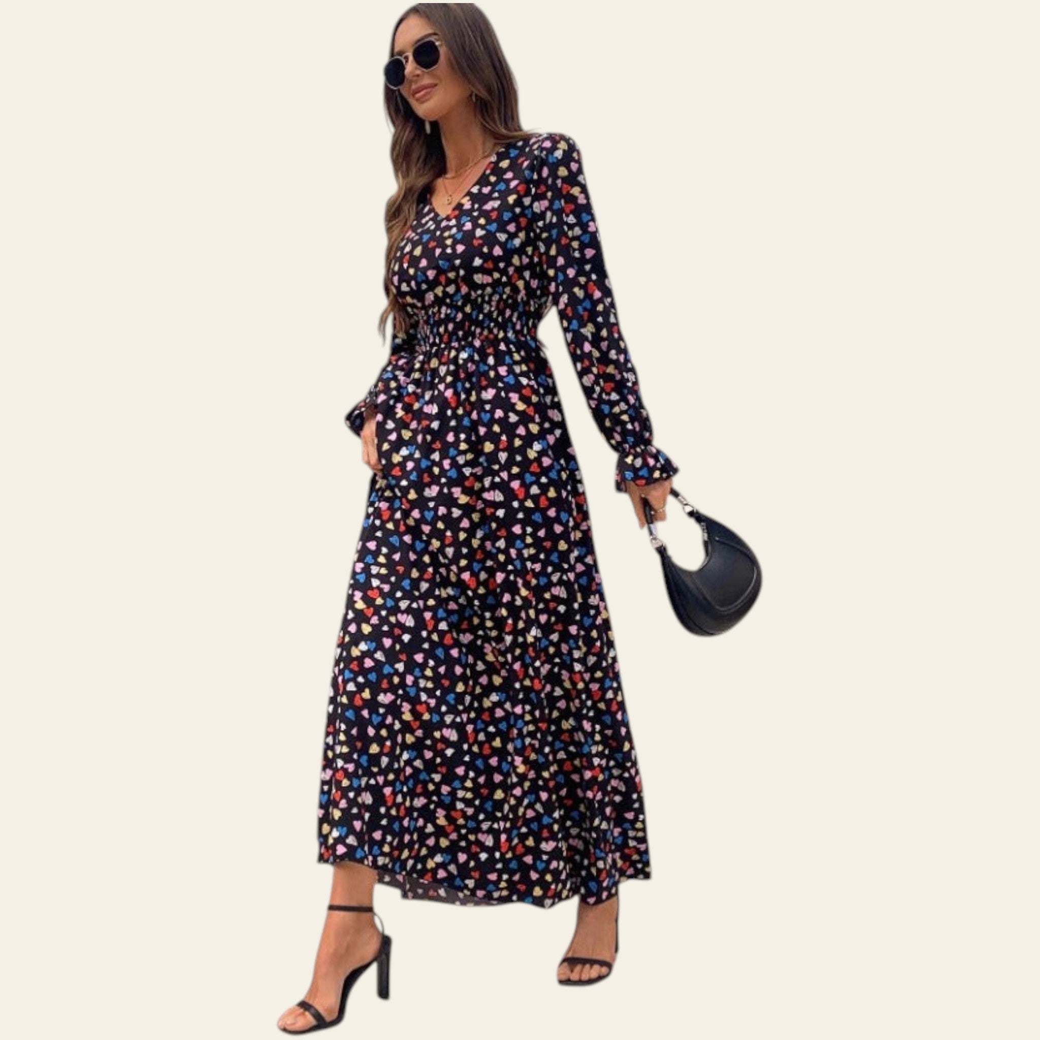 woman wearing a long sleeve floral maxi dress indoors
