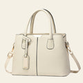 Beige handbag with a strap on a white background