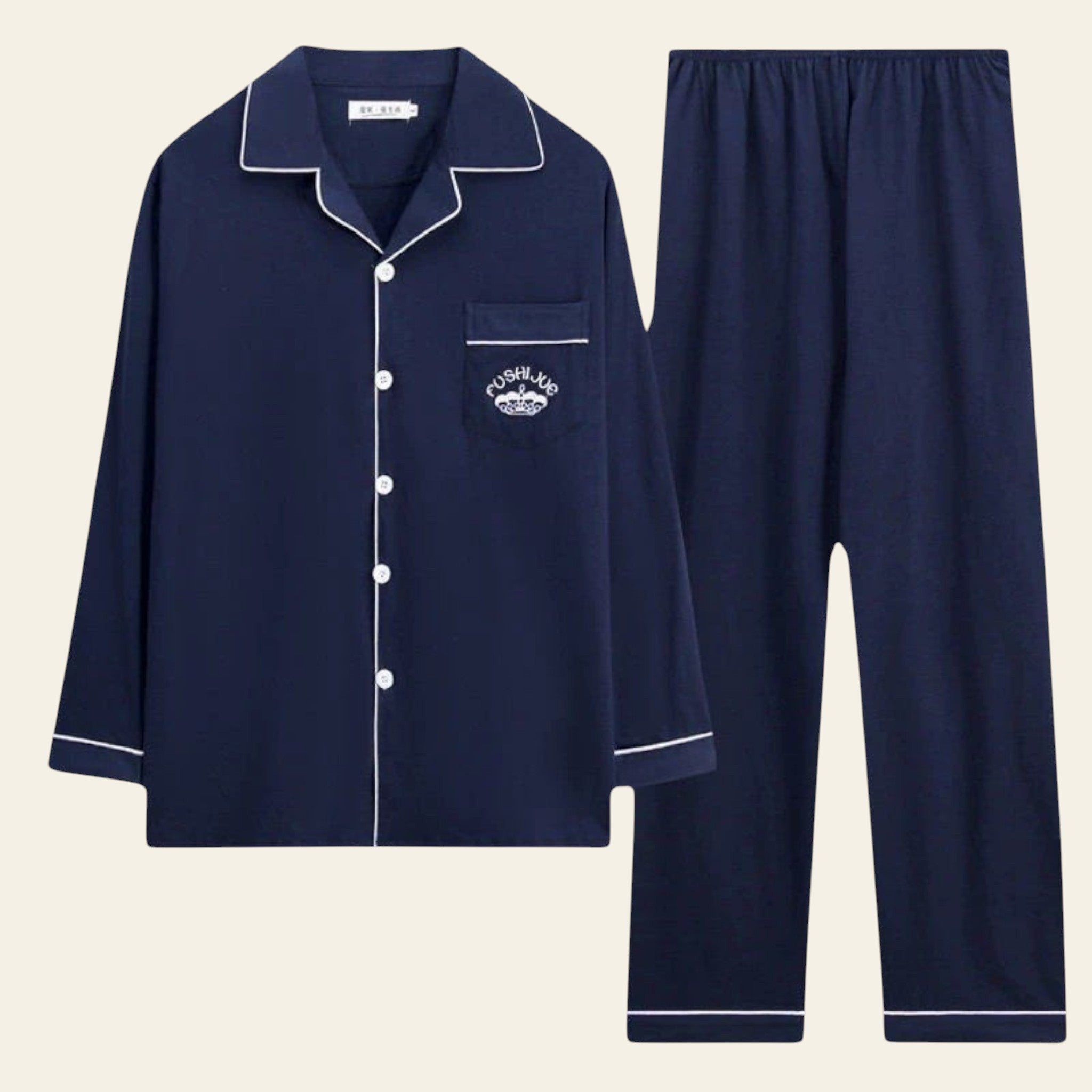 Navy blue pajama set with white piping on a white background