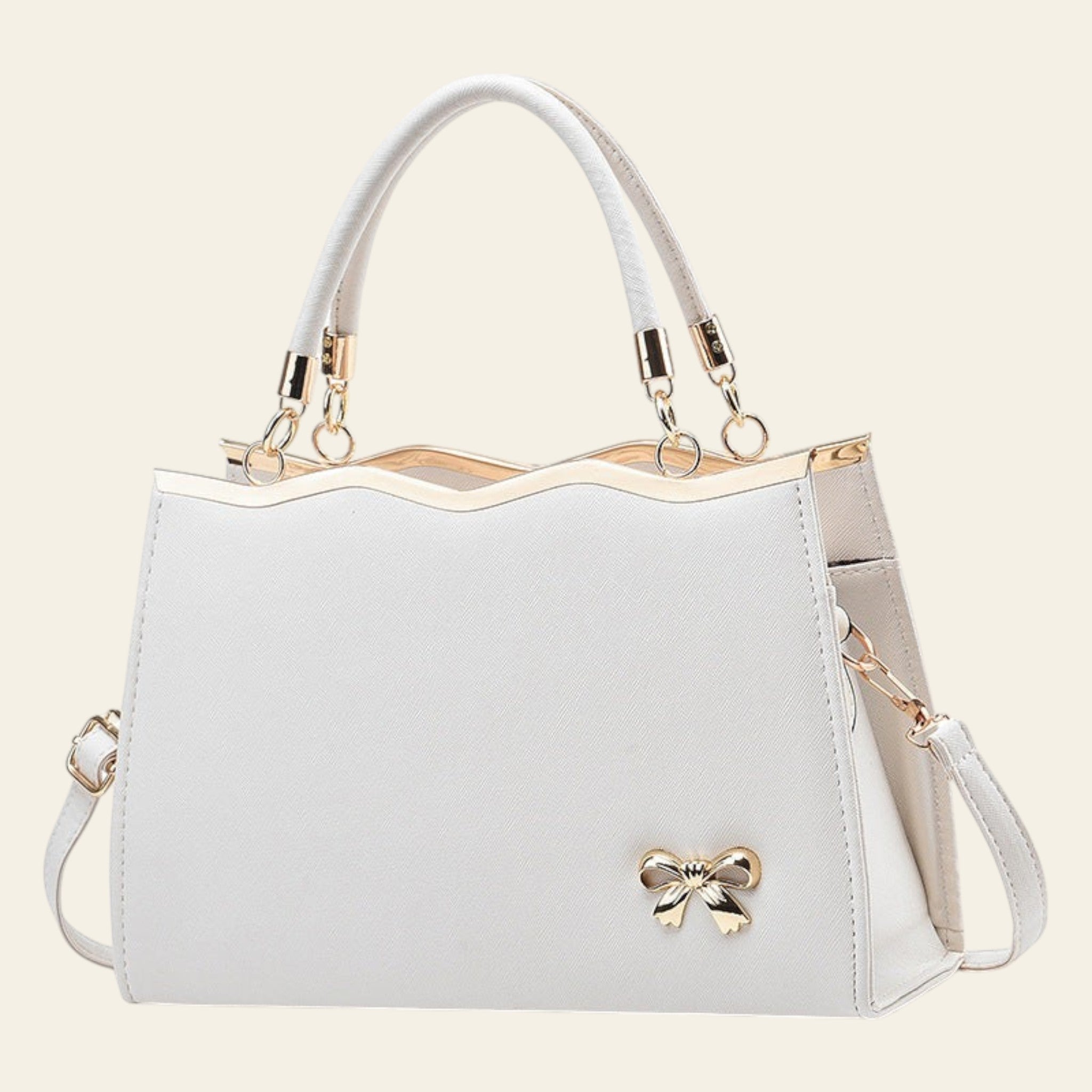 White handbag with gold accents on a white background