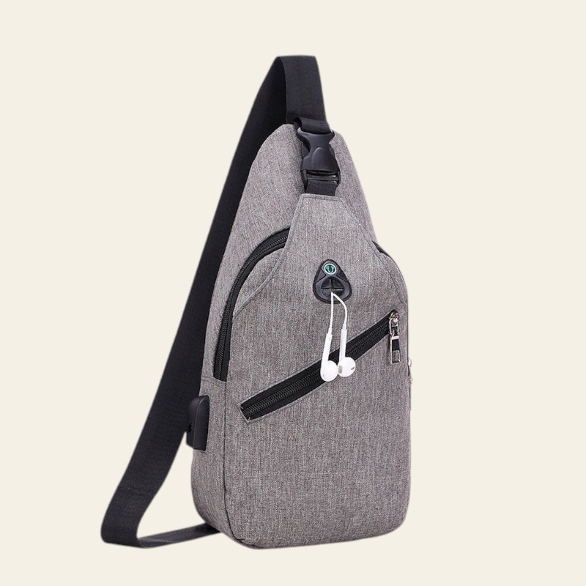 Gray sling bag with black strap on a white background