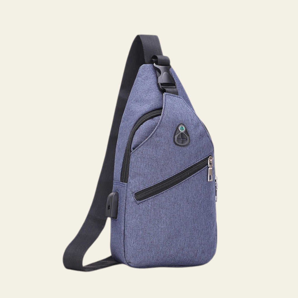Blue sling bag with black accents on a white background