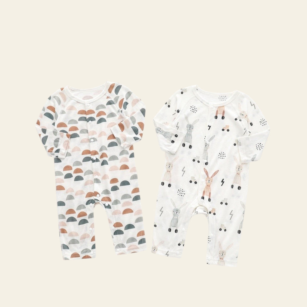 Two bamboo fiber printed baby onesies on a white background