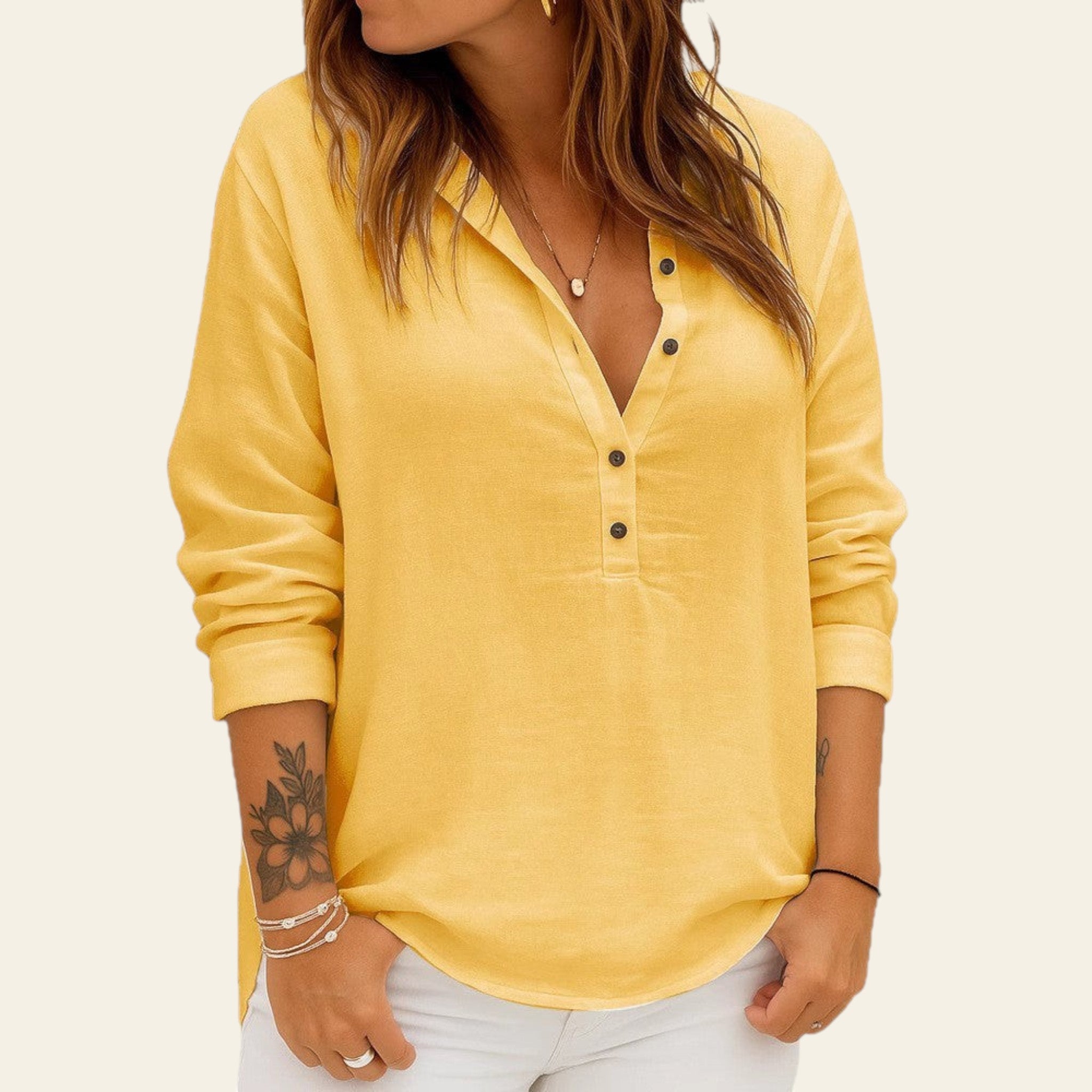 Yellow long-sleeve shirt worn by a person on a white background
