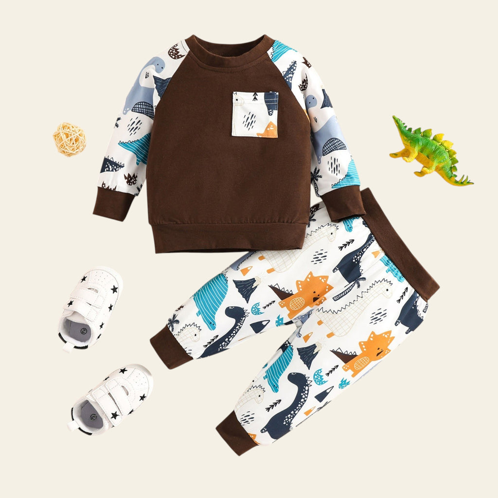 Children's outfit with brown sweater and patterned pants on a beige background
