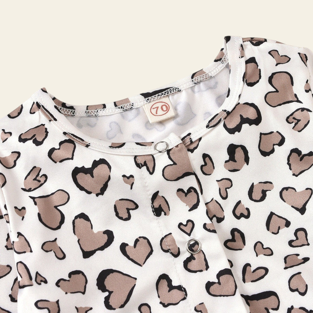 White tank top with brown heart pattern on a grid background