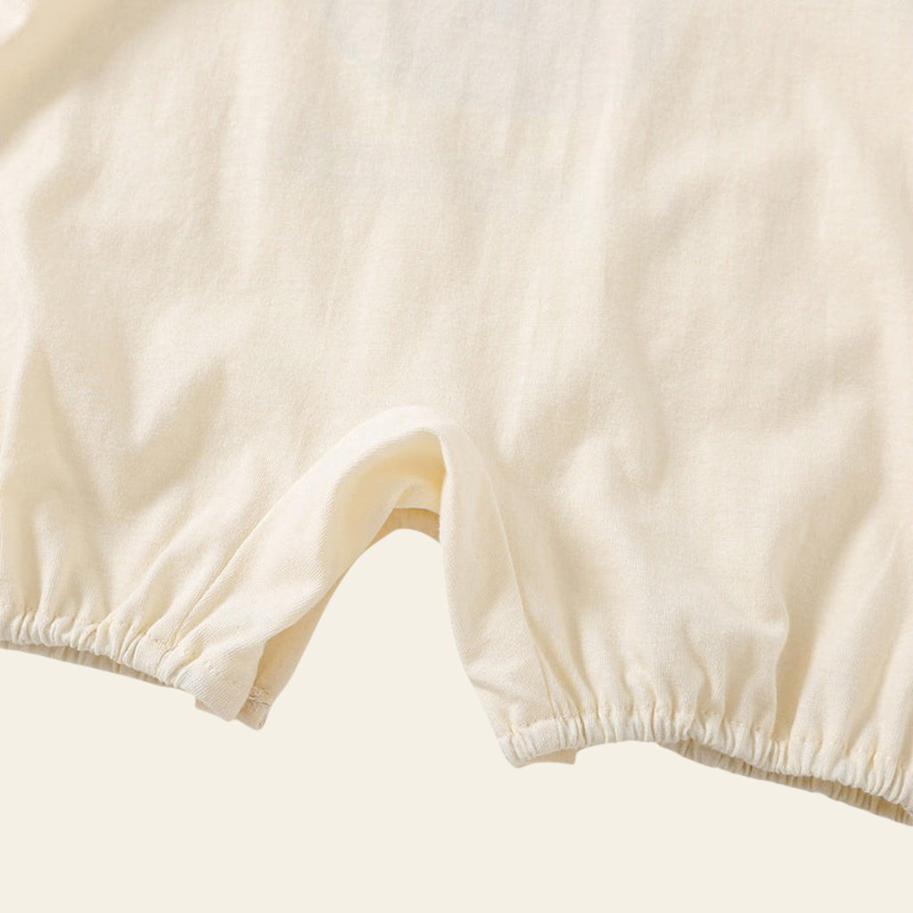 Close-up of beige shorts on a light gray background