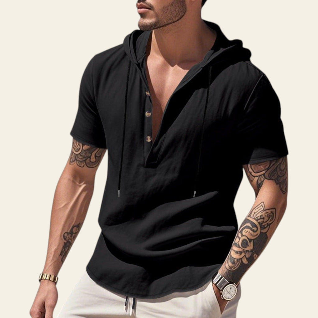 Man wearing a black breathable linen hooded short sleeve henley shirt at the beach
