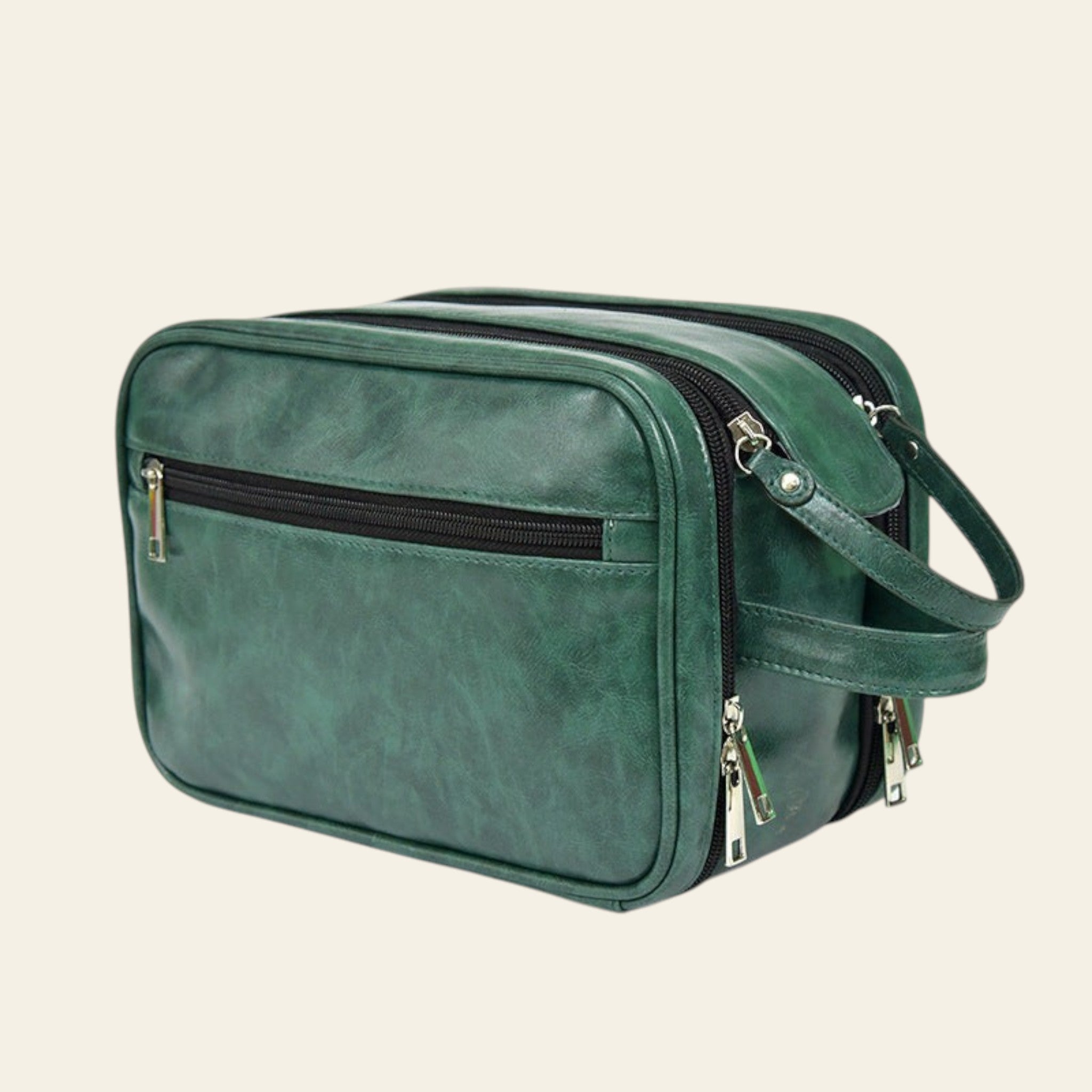 Green handbag with multiple zippers on a white background