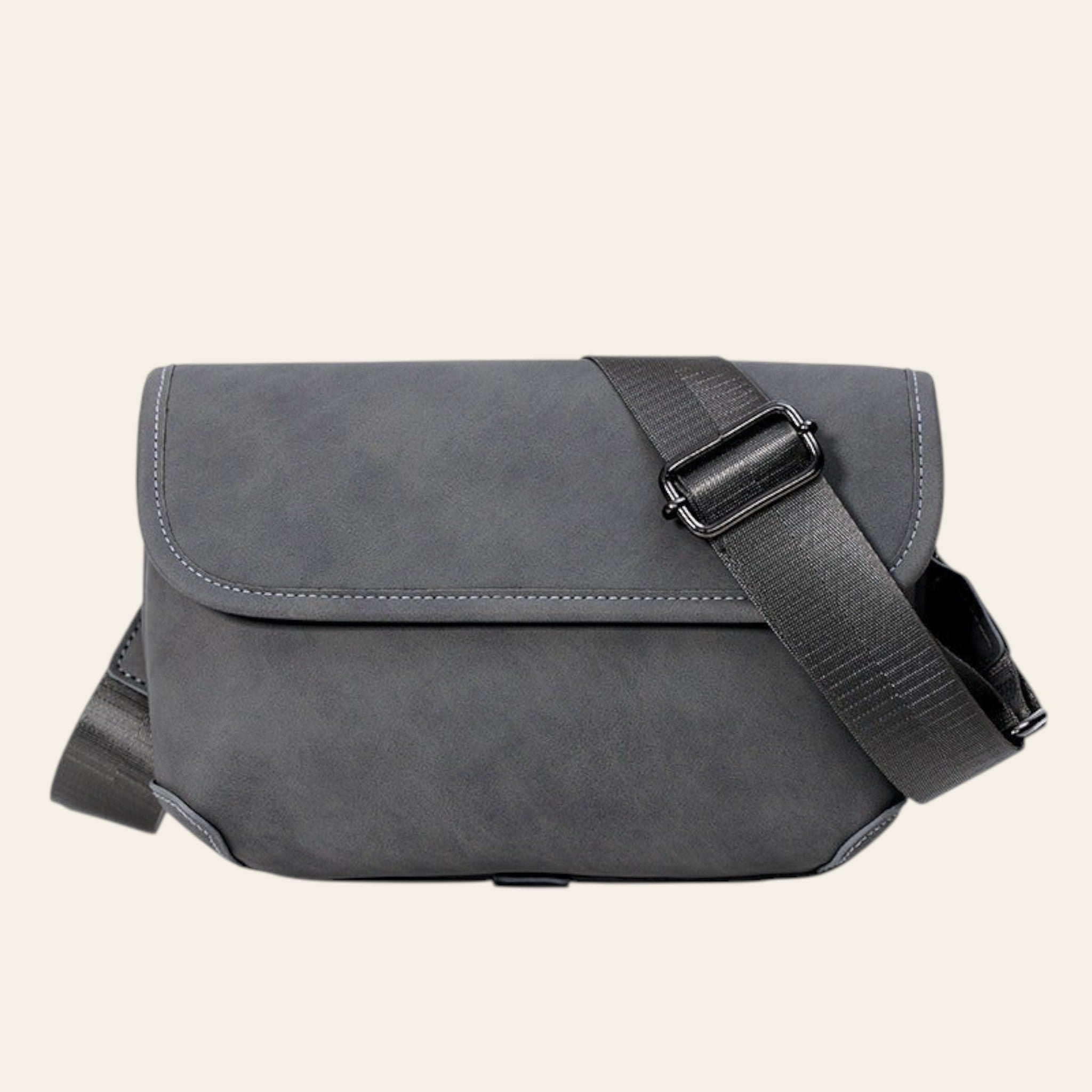 Gray shoulder bag with a strap on a white background