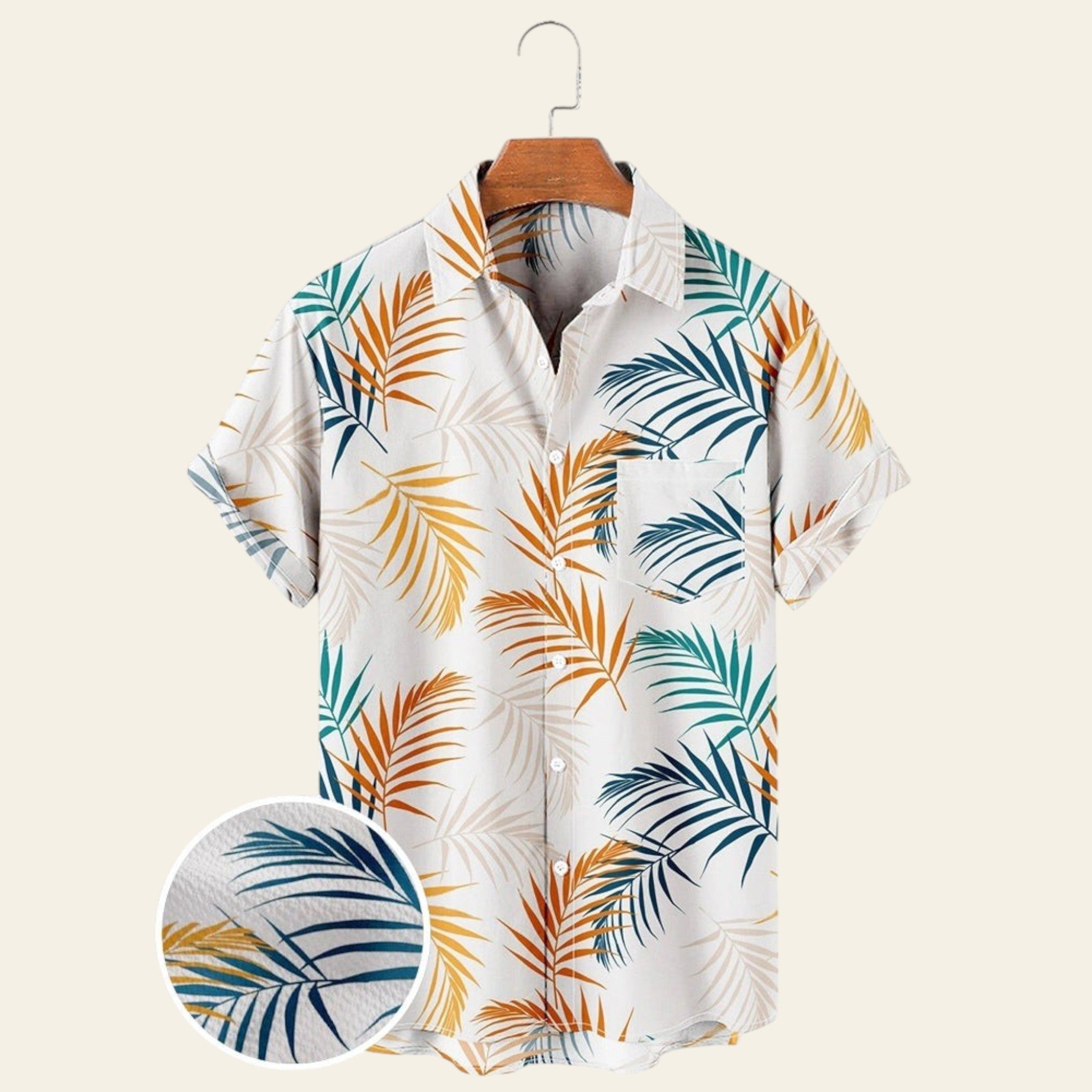 White men's short sleeve tropical shirt with blue and orange palm leaf print, wrinkle-free casual button-up shirt on hanger