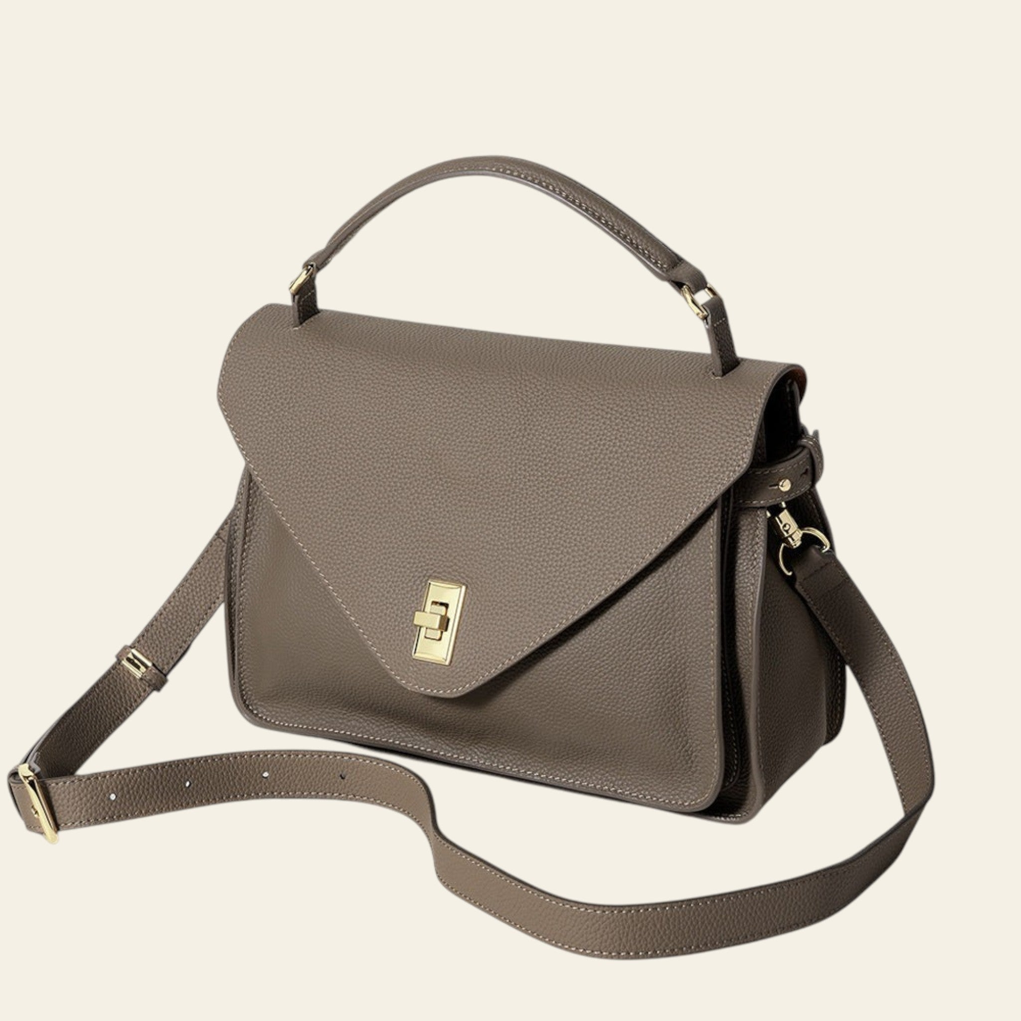 Brown handbag with a gold clasp on a white background