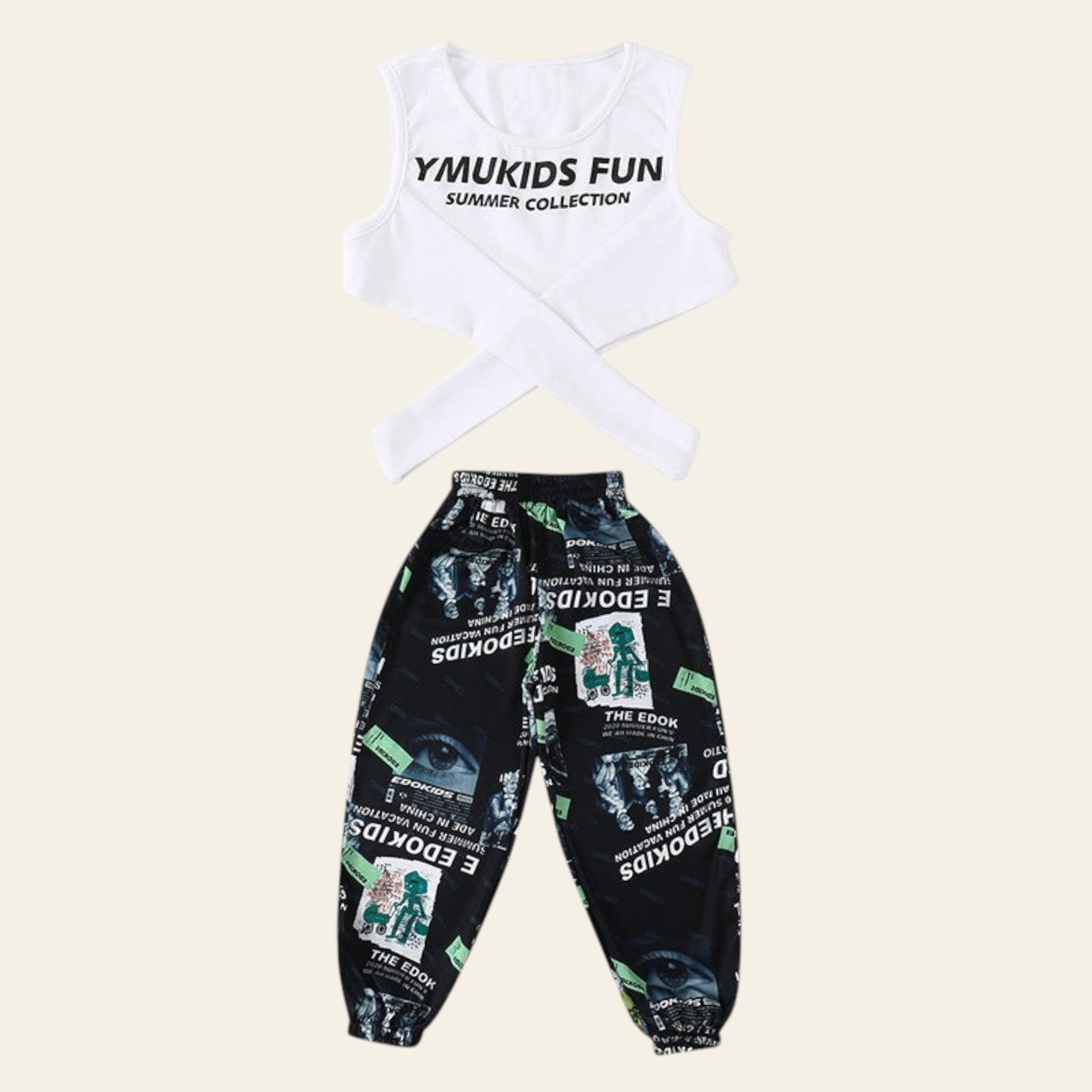 Children's outfit with a white top and patterned black pants on a white background