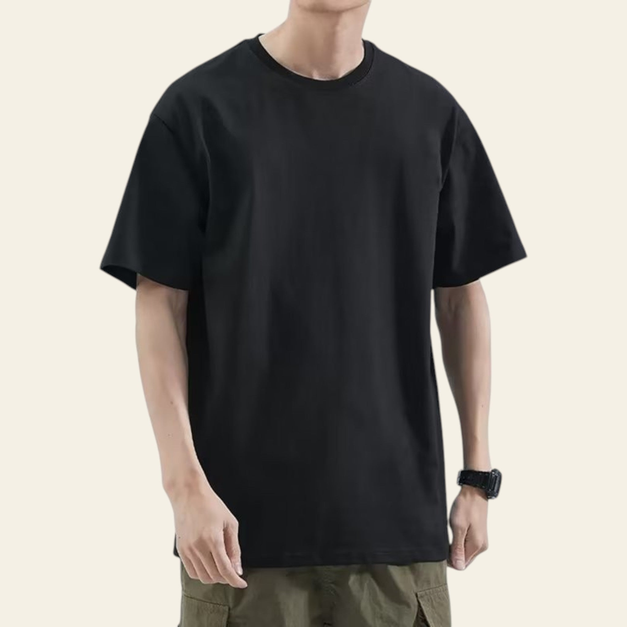 Man wearing a black loose fit solid color t-shirt
