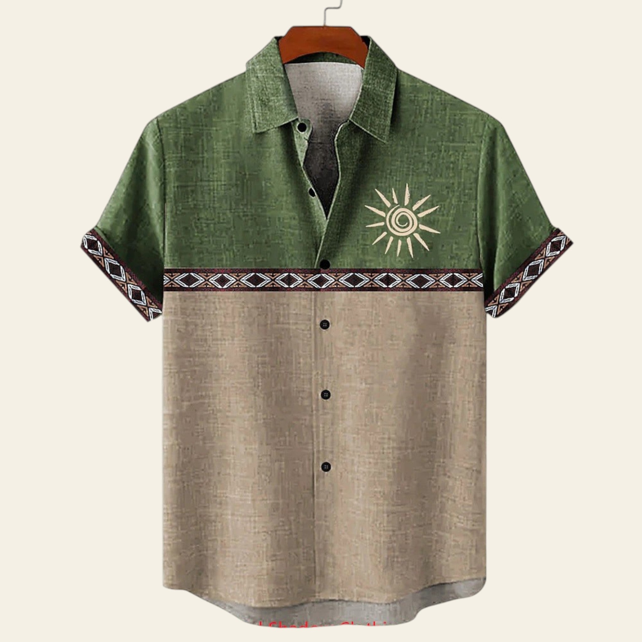 Green and beige shirt with sun design on a hanger against a white background