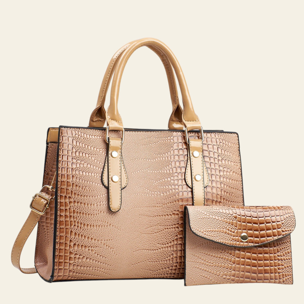 Brown crocodile-textured handbag with matching wallet on a light gray background