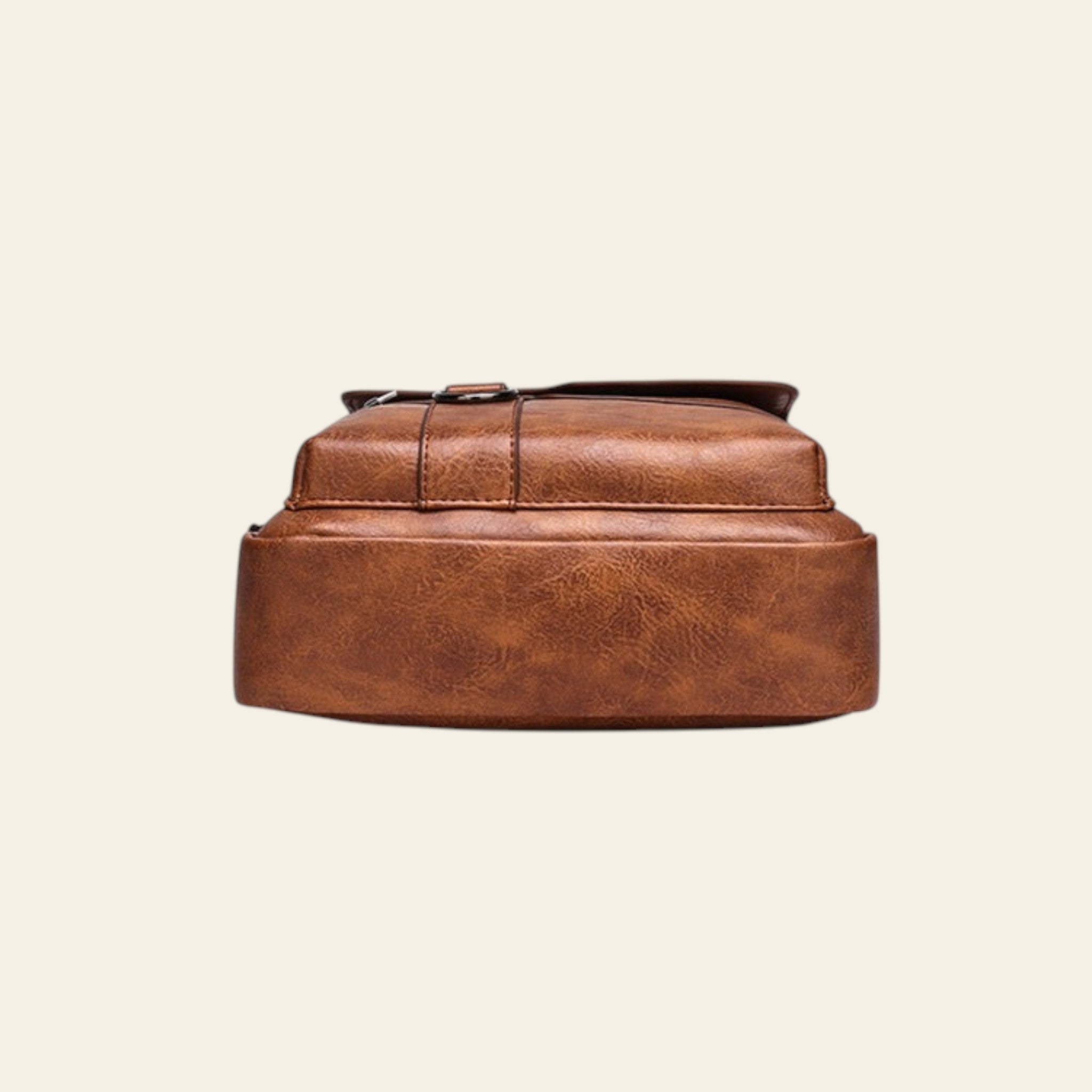 Brown leather backpack on a white background