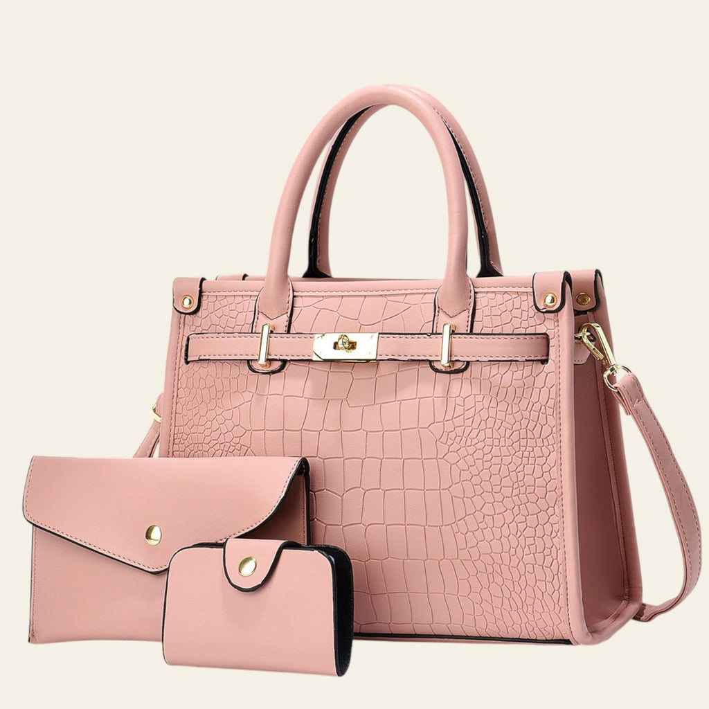 Pink handbag with matching wallet on a light gray background