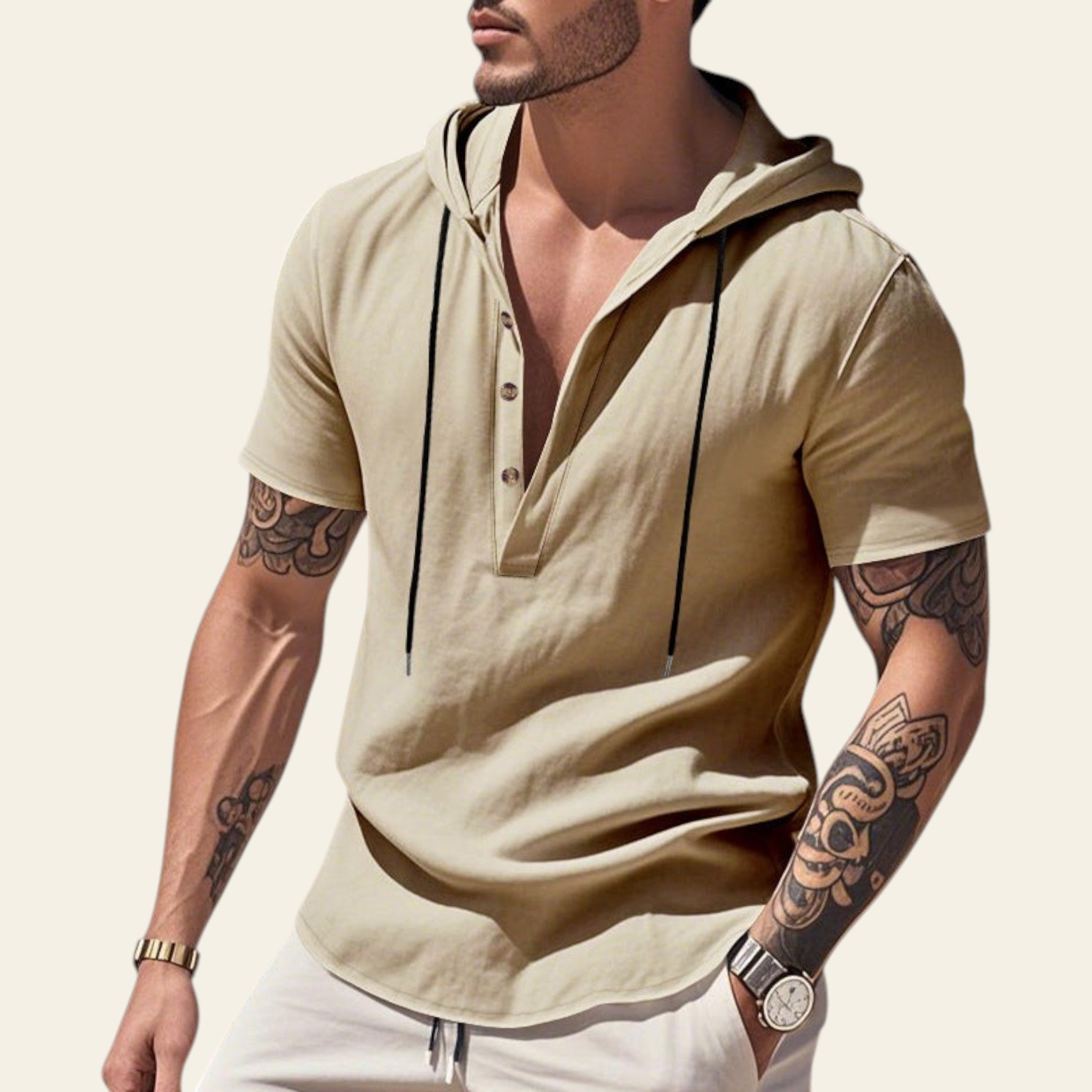 Man wearing an apricot breathable linen hooded short sleeve henley shirt at the beach