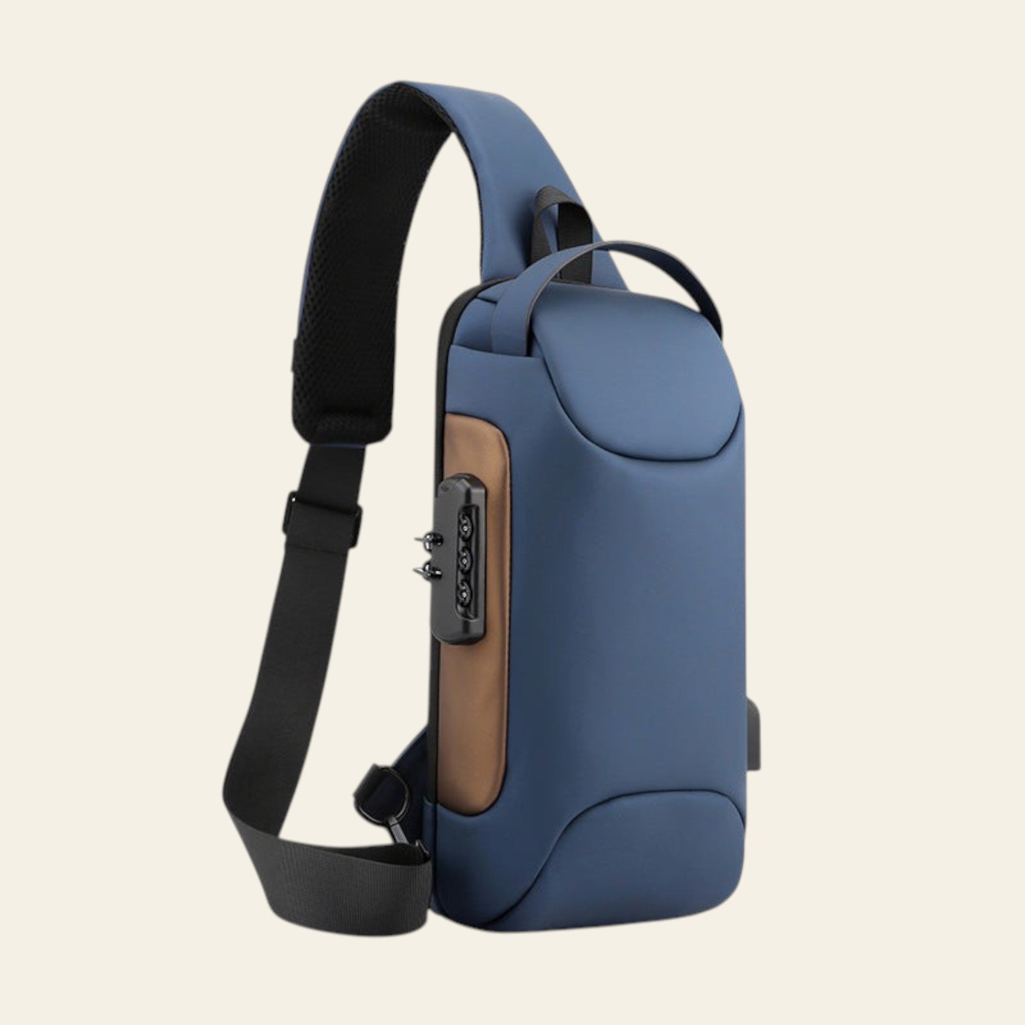 Blue sling bag with a brown leather patch on a white background