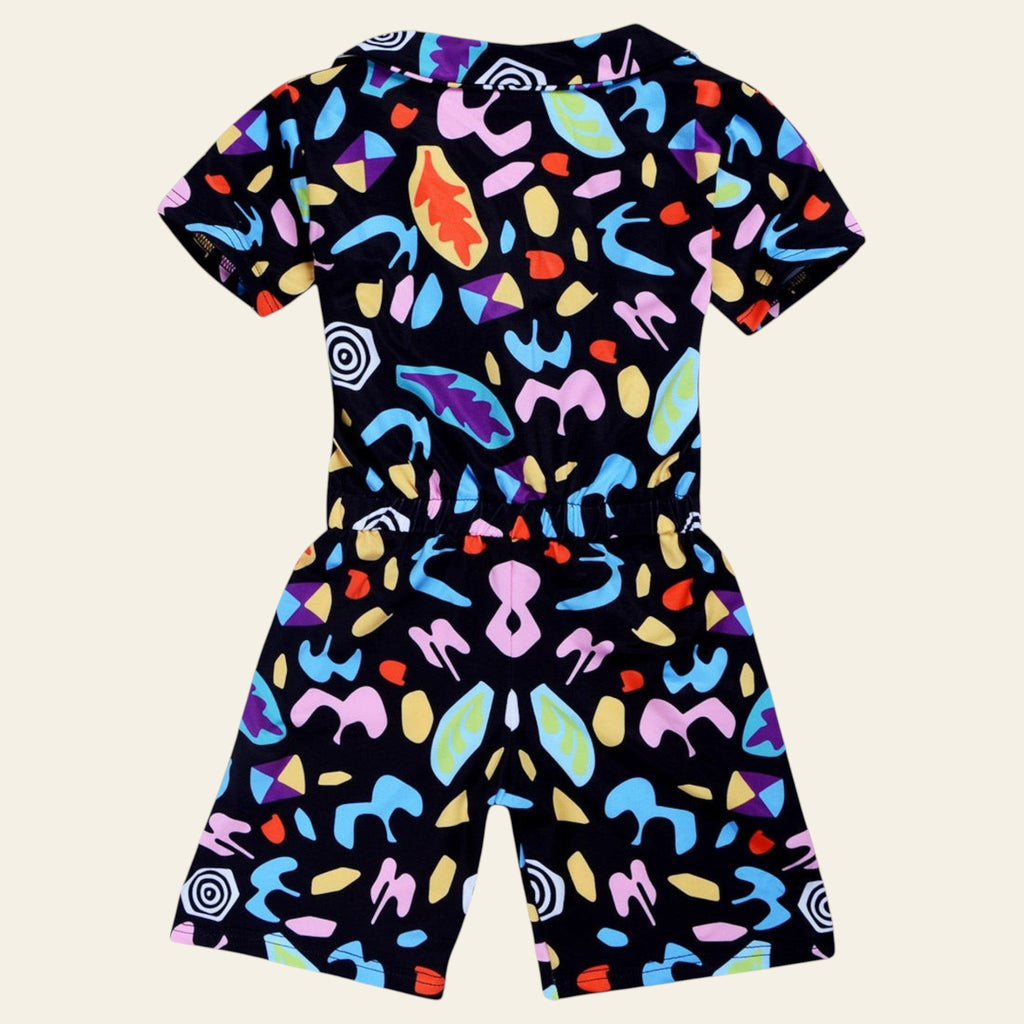 Colorful patterned romper on a white background