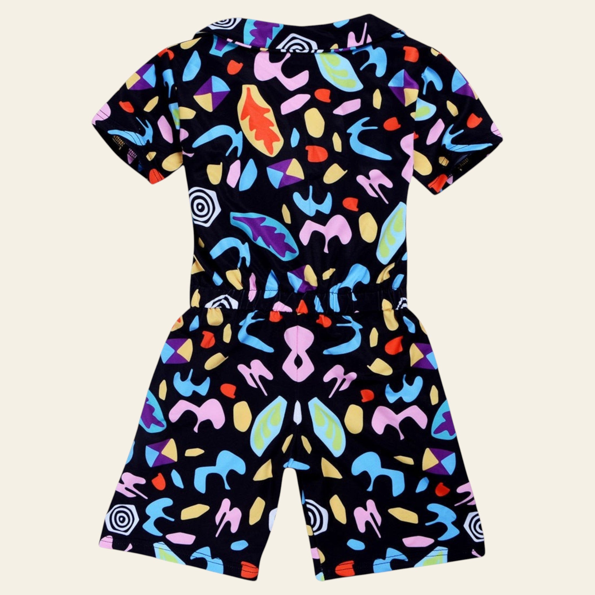 Colorful patterned romper on a white background