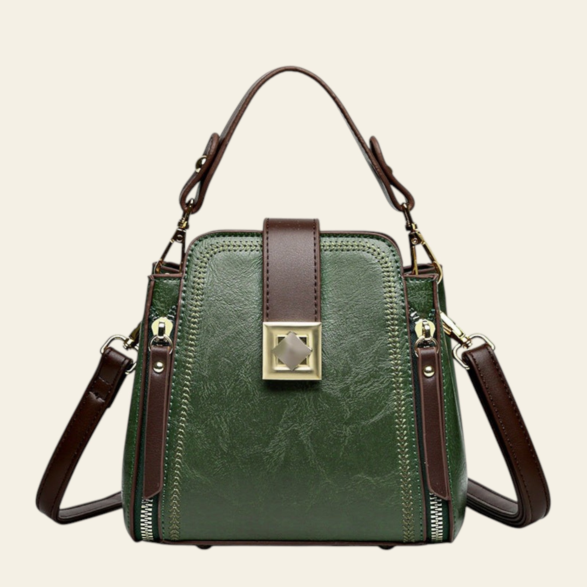 Green handbag with brown straps on a white background