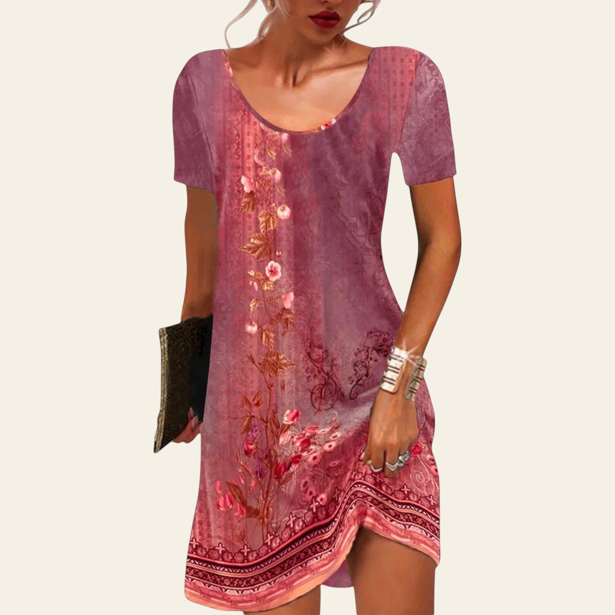 woman wearing a pink floral short-sleeve summer dress with a relaxed fit