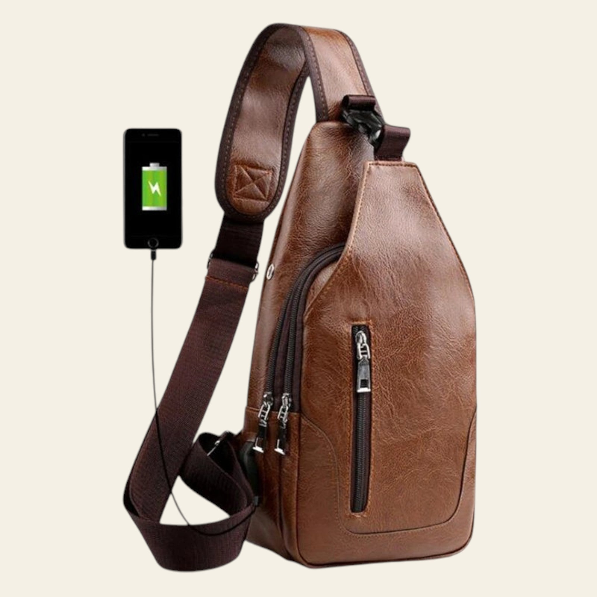 Brown leather sling bag with a smartphone attached to it on a white background